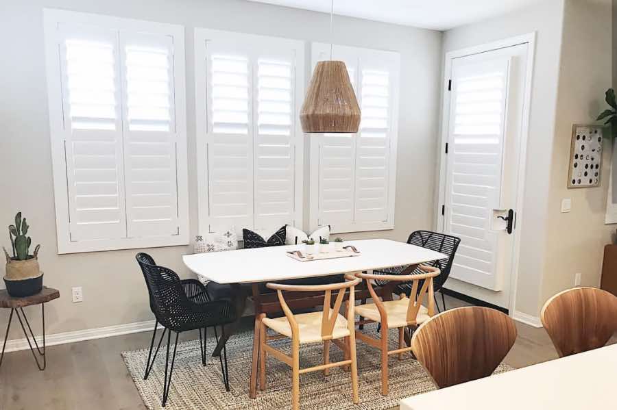 Use Polywood shutters to control natural light levels in your Bakersfield dining room. Polywood shutters with top louvers tilted open in a dining room