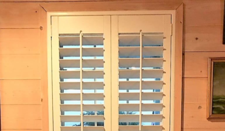 Plantation shutters fit many window shapes and sizes.  Plantation shutters in a long window.