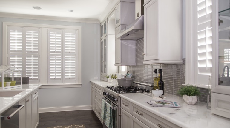 White shutters in Bakersfield kitchen with marble counter.