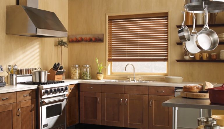 Bakersfield kitchen faux wood blinds.