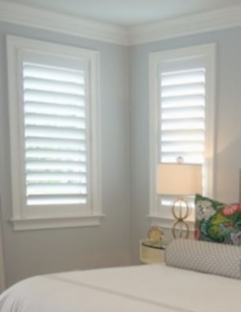 Hidden tilt rod shutters open. White plantation shutters with hidden tilt rods in Bakersfield