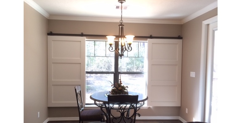 Barn doors open horizontally with slides instead of cords. Bakersfield barn door shutters