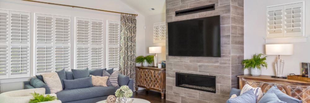 Plantation shutters in Buttonwillow living room with fireplace