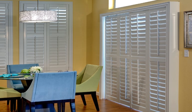 Plantation shutters on a French door function like common window shutters. Patio Doors with Plantation Shutters in Bakersfield