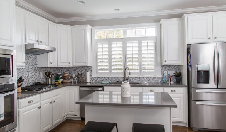Polywood® plantation shutters resist heat and moisture in your kitchen. Polywood shutters in a Bakersfield gourmet kitchen.