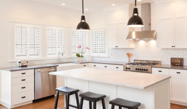 Plantation shutters let you control the amount of light in your kitchen. Plantation shutters in a bright Bakersfield kitchen.