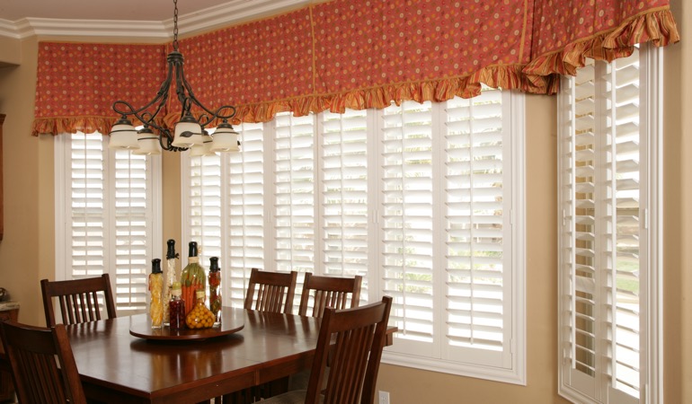 Decorative accents, drapes, and curtains may not provide the simplistic style you are going for. White shutters in Bakersfield dining room.