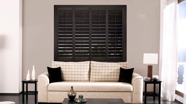 Bakersfield sunroom with black shutters.