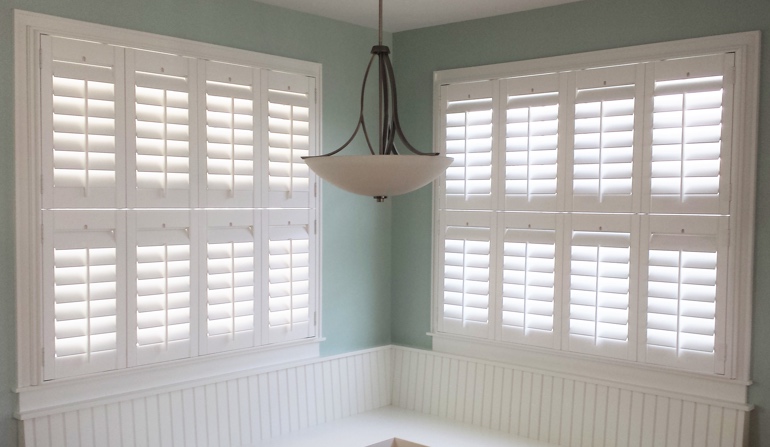 Soft green wall in Bakersfield kitchen with shutters.