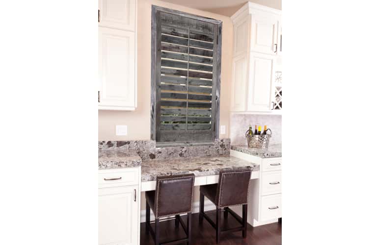 Kitchen window with reclaimed wood shutters in Bakersfield