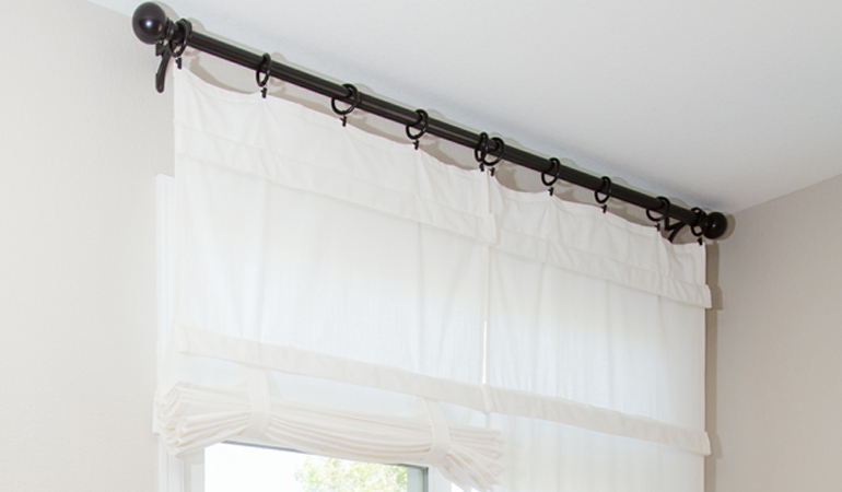 Tumble shades in Bakersfield give your doors privacy versatility and style. White tumble shade on double glass doors