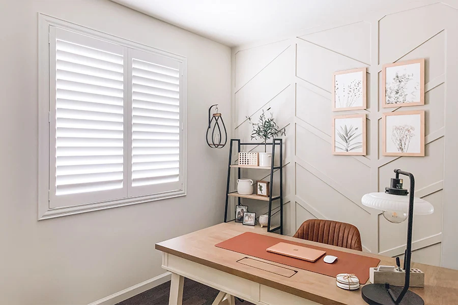 White Polywood shutters on a home office window